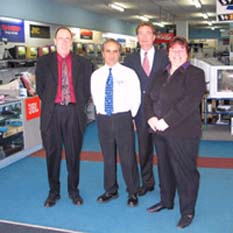 A&P Electronics’ store in Traralgon; l-r: Bill Lawler, Andrew Panayiotou, Cr Peter Tyler and Tina Hunt