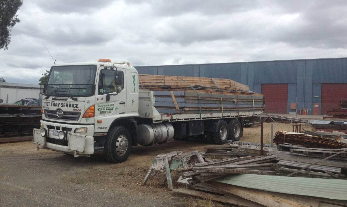 Hire a tilt tray truck to transport oversized timber beams with East Gippsland Tilt Tray Service from Lakes Entrance