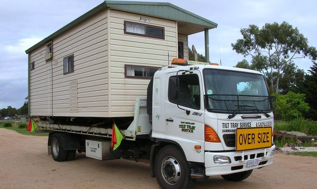 Hire a tilt tray truck to transport a portable home with East Gippsland Tilt Tray Service from Lakes Entrance