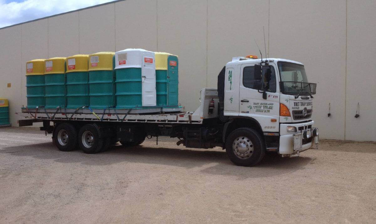 Hire a tilt tray truck to transport a portable toilets with East Gippsland Tilt Tray Service from Lakes Entrance