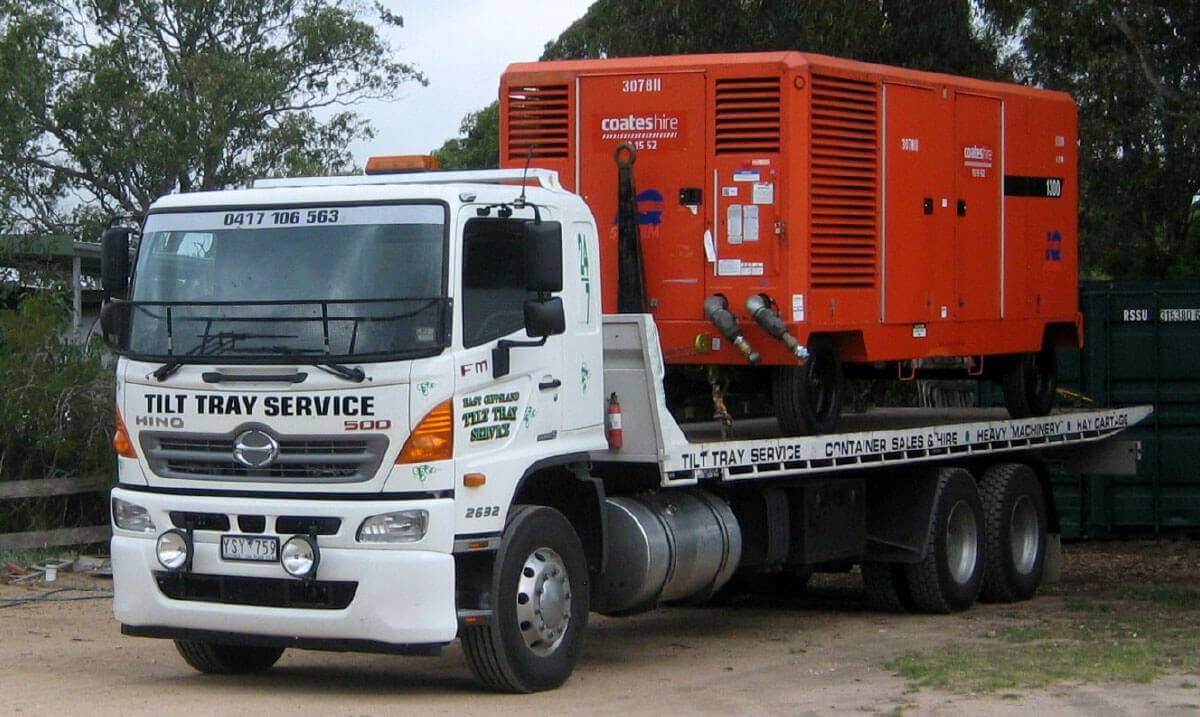 Hire a tilt tray truck to transport an oversized electrical power generator with East Gippsland Tilt Tray Service from Lakes Entrance