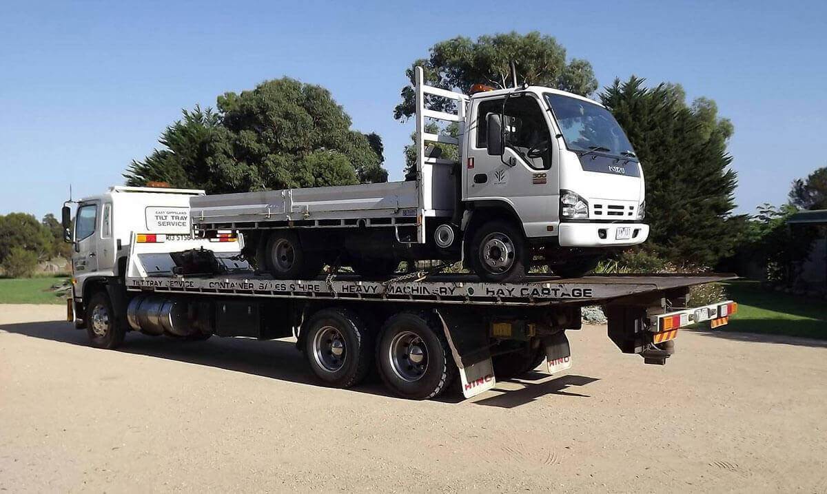 Hire a tilt tray truck to transport an oversized small truck with East Gippsland Tilt Tray Service from Lakes Entrance